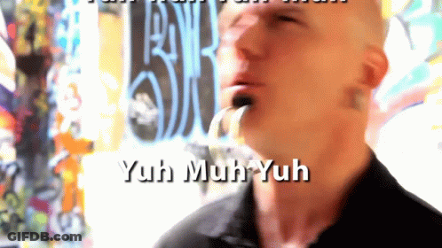 A Man Is Smoking A Cigarette And The Words Yuh Muh Yuh Are On The Screen GIF