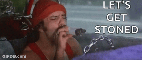 A Man Is Smoking A Cigarette In A Car With The Words `` Let 'S Get Stoned '' Written On The Bottom . GIF