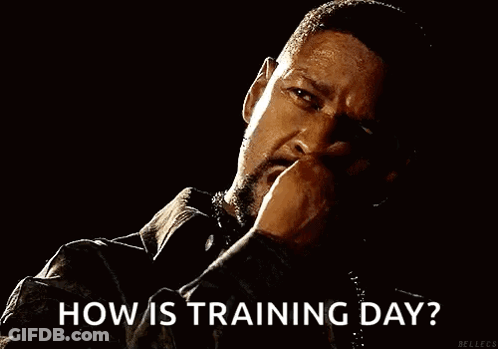 A Man Is Smoking A Cigarette In A Dark Room And Asking How Is Training Day . GIF