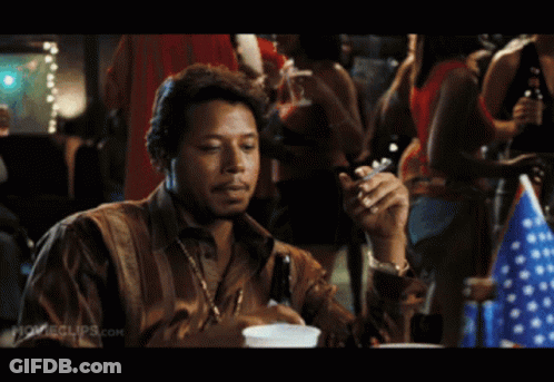 A Man Is Smoking A Cigarette In A Movie Clip GIF