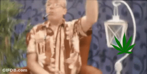 A Man Is Smoking A Cigarette Next To A Marijuana Leaf And A Lantern . GIF