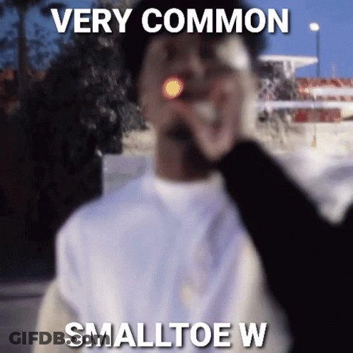 A Man Is Smoking A Cigarette With A Caption That Says Very Common Smalltoe W . GIF