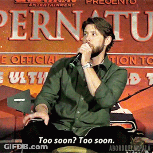 A Man Is Speaking Into A Microphone In Front Of A Sign That Says Pernuatu GIF