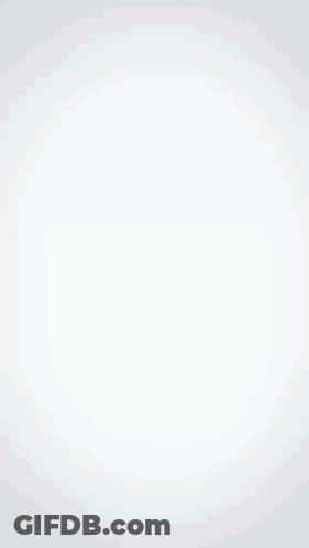 A Man Is Speaking Into A Microphone With The Name Alexander Under On His Shirt GIF