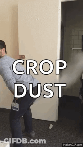 A Man Is Spraying Crop Dust On The Door GIF