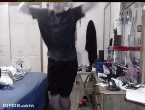 A Man Is Standing In A Bedroom With His Arms Outstretched And A Basketball Jersey On The Wall . GIF