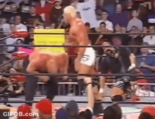 A Man Is Standing In A Boxing Ring With A Yellow Box In The Background . GIF