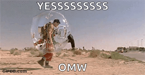 A Man Is Standing In A Bubble In The Desert With A Bird On His Back . GIF