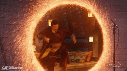 A Man Is Standing In A Circle Of Fire With A Disney Logo On The Bottom GIF