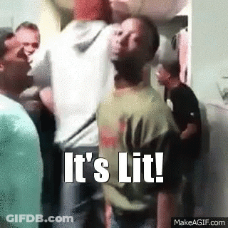 A Man Is Standing In A Crowd Of People With The Words `` It 'S Lit '' Written On The Bottom . GIF
