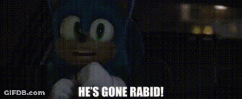 A Man Is Standing In A Dark Room And Says He 'S Gone Rabid GIF