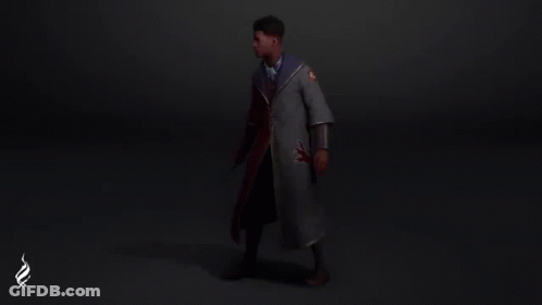 A Man Is Standing In A Dark Room Wearing A Cape With A Lion On It . GIF