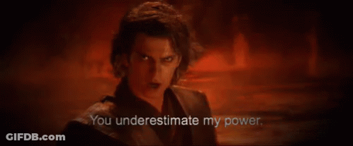 A Man Is Standing In A Dark Room With A Red Background And Says `` You Underestimate My Power . '' GIF