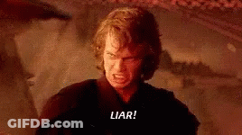 A Man Is Standing In A Dark Room With A Sword In His Hand . GIF