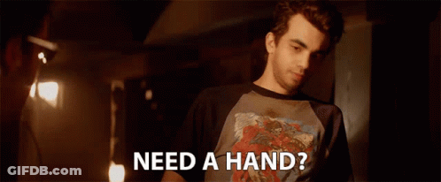 Man Standing In Dark Room Saying Need A Hand GIF