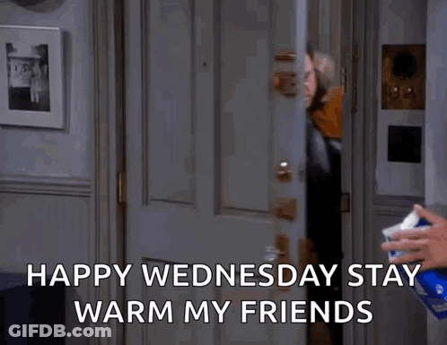 A Man Is Standing In A Doorway With The Words Happy Wednesday Stay Warm My Friends GIF