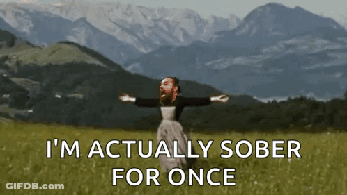 A Man Is Standing In A Field With His Arms Outstretched And The Words " I 'M Actually Sober For Once " GIF