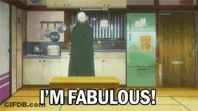 A Man Is Standing In A Kitchen And Says I 'M Fabulous . GIF