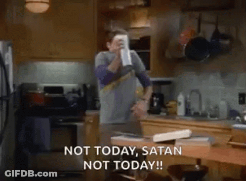 A Man Is Standing In A Kitchen Holding A Cup In His Hand And Saying `` Not Today , Satan Not Today '' . GIF