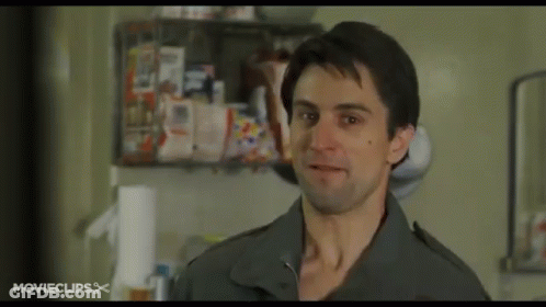 A Man Is Standing In A Kitchen With A Movie Clips Logo On The Bottom GIF