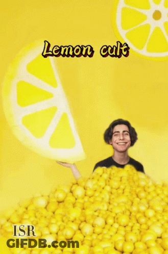 A Man Is Standing In A Pile Of Lemons With The Words Lemon Cult Written On The Bottom GIF