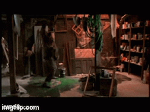 A Man Is Standing In A Room With A Ladder And A Sign That Says Imgflip.com On The Bottom GIF