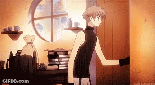 A Man Is Standing In A Room With A Stack Of Books On A Table And A Window . GIF