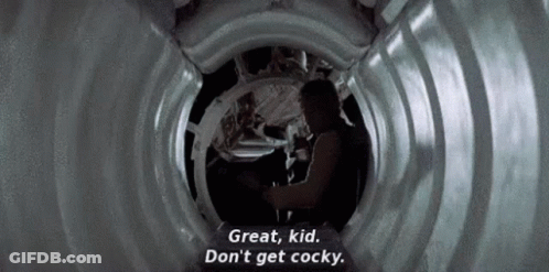 A Man Is Standing In A Tunnel And Talking To A Woman . GIF