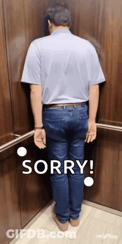 A Man Is Standing In An Elevator And Says Sorry GIF