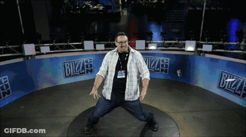 A Man Is Standing In Front Of A Bizzard Sign GIF
