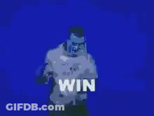 A Man Is Standing In Front Of A Blue Wall With The Word Win On It GIF