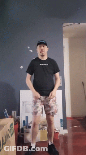A Man Is Standing In Front Of A Box That Says Jam2 GIF