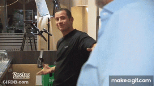 A Man Is Standing In Front Of A Box That Says Rosin 'S GIF