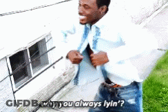 A Man Is Standing In Front Of A Building With His Shirt Open And Says Why You Always Lyin '? GIF