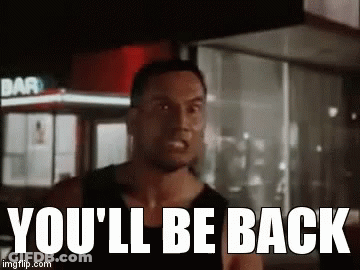 A Man Is Standing In Front Of A Building With The Words `` You 'Ll Be Back '' . GIF