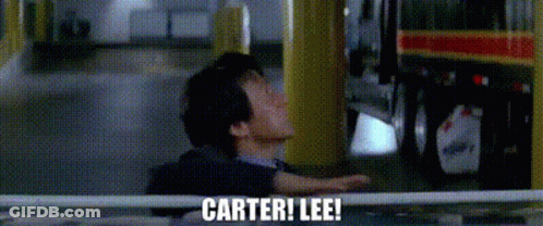 A Man Is Standing In Front Of A Bus With The Words Carter ! Lee ! Written On The Screen . GIF