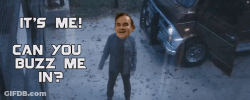 A Man Is Standing In Front Of A Car With The Words " It 'S Me Can You Buzz Me In " GIF