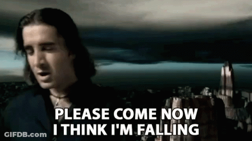 A Man Is Standing In Front Of A Castle And Saying `` Please Come Now I Think I 'M Falling '' GIF