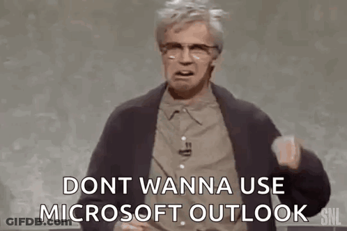 A Man Is Standing In Front Of A Chalkboard And Talking About Microsoft Outlook . GIF