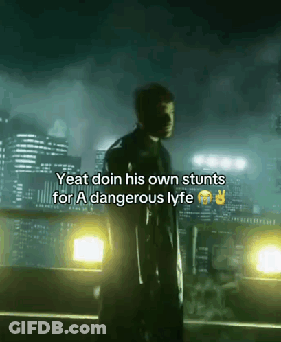 A Man Is Standing In Front Of A City Skyline And Says Yeat Doin His Own Stunts For A Dangerous Lyft GIF