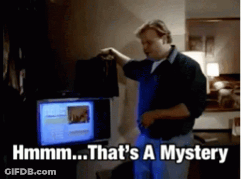 A Man Is Standing In Front Of A Computer And Says That 'S A Mystery GIF