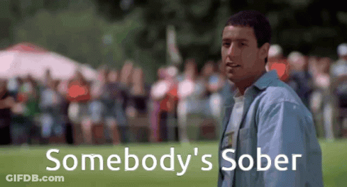 A Man Is Standing In Front Of A Crowd And The Words Somebody 'S Sober Are On The Screen Behind Him GIF