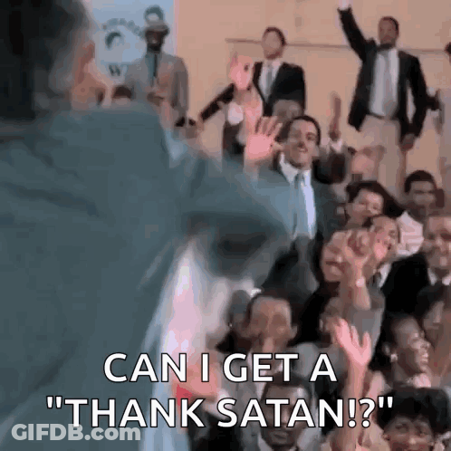 A Man Is Standing In Front Of A Crowd Of People And Saying `` Can I Get A Thank Satan ? '' . GIF