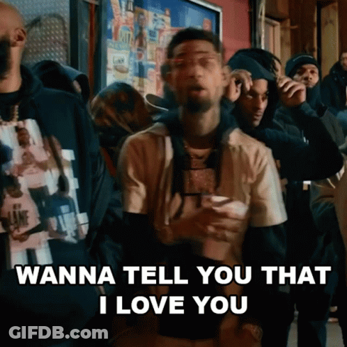 A Man Is Standing In Front Of A Crowd Of People And Saying `` Wanna Tell You That I Love You '' GIF
