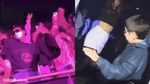 A Man Is Standing In Front Of A Crowd Of People At A Concert And A Boy Is Sitting In The Audience . GIF
