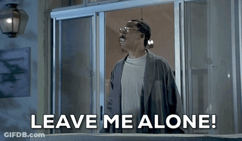 A Man Is Standing In Front Of A Door With The Words " Leave Me Alone " Written Below Him GIF