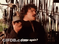 A Man Is Standing In Front Of A Fence Talking On A Cell Phone And Asking To Come Again . GIF