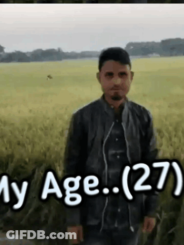 Man Standing In Field With Age 27 GIF