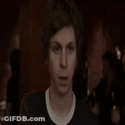 A Man Is Standing In Front Of A Fire With The Words I Gotta Written On The Bottom GIF