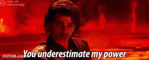 A Man Is Standing In Front Of A Fire With The Words `` You Underestimate My Power '' Written On It . GIF